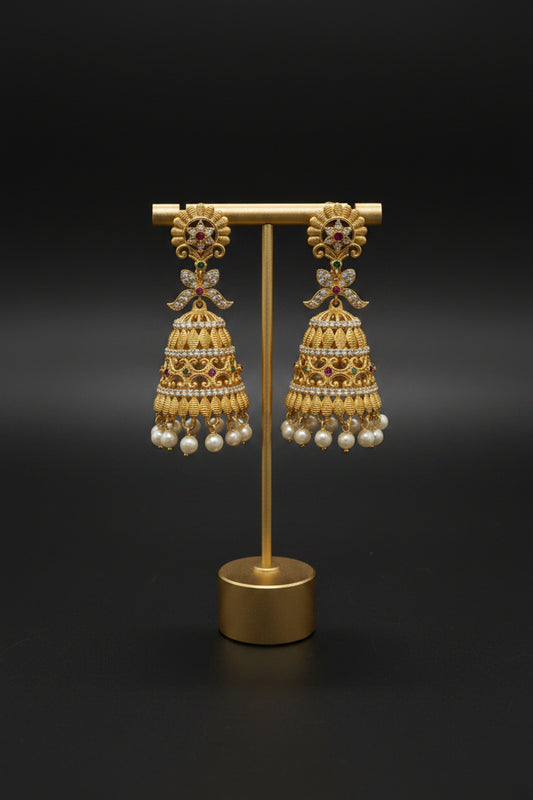 Tiered CZ Jhumka Earrings – Antique Gold with Bow Connector & Pearl Drops